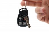 stock photo of keys  - A hand holding car keys and a remote control for key - JPG 