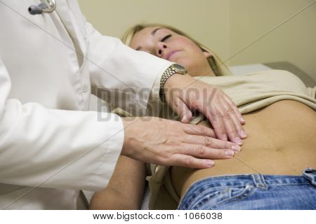 Picture or Photo of A doctor examining a teenage female patient **Note, slight graininess, best at small sizes.