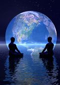 stock photo of earth  - Two human silouhettes meditating in front of the earth by night - JPG 