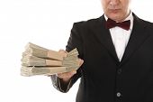 picture of money  - Man is offering money for payment or bribe - JPG 