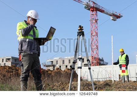 Picture or Photo of Worker in front of a laptop computer on site