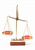 stock photo of outcome  - Risk and reward dice on weighing scales - JPG 