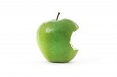 foto of bites  - Single green apple with bite isolated on a white background - JPG 