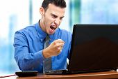 image of pressure  - Angry businessman against his computer - JPG 