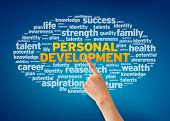 pic of health  - Hand pointing at a Personal Development Word Cloud on blue background - JPG 
