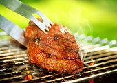 image of outdoor  - Flames Grilling a Steak on the BBQ - JPG 