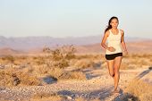 pic of fitness  - Woman runner running cross country trail run - JPG 