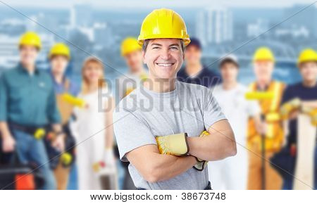 Picture or Photo of Smiling Construction worker man. Architecture background.