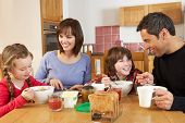 pic of france  - Family Eating Breakfast Together In Kitchen - JPG 