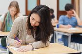 pic of college  - Woman doing an exam in exam hall in college - JPG 