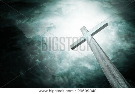 Picture or Photo of Wooden cross on dark sky, abstract background