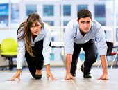 picture of competition  - Competitive business couple racing at the office - JPG 