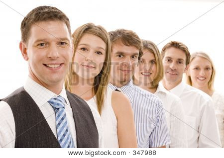 Picture or Photo of Six business men and women in a line (shallow depth of field used)