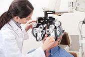 pic of medical doctors  - Optometrist doing sight testing for pateient - JPG 