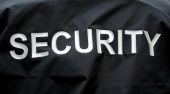 stock photo of security  - macro of a jacket of a security guard - JPG 