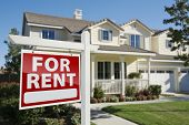 stock photo of house  - Right Facing Red For Rent Real Estate Sign in Front of Beautiful House - JPG 