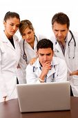 stock photo of computer technology  - Group of doctors with a computer  - JPG 