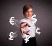 stock photo of currency  - Pretty young lady throwing currency icons - JPG 