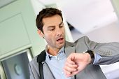 image of watch  - Businessman running late for work - JPG 