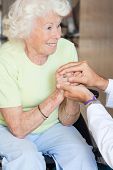 picture of medical doctors  - Doctor comforting happy senior woman - JPG 
