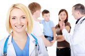 foto of medical doctors  - portrait of happy successful female doctor with the young family - JPG 