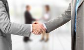 stock photo of handshake  - handshake isolated on business background - JPG 