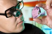 foto of glisten  - Jeweller appraising quality of diamond - JPG 