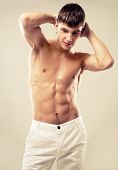 picture of man  - attractive young muscular man wearing white jeans - JPG 