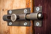 foto of latch  - Close-up shot of a latch on a wooden door
** Note: Shallow depth of field - JPG 