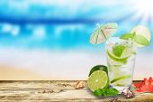 picture of beach  - Fresh summer cocktail on wooden table - JPG 