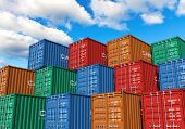 stock photo of industrial  - Stacked cargo containers in storage area of freight sea port terminal - JPG 