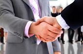 stock photo of handshake  - handshake isolated on business background - JPG 