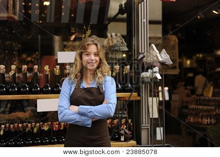 Picture or Photo of Small business owner in front of store