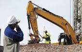 picture of industrial  - bulldozer and industrial workers in action - JPG 