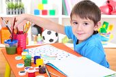 picture of boy  - Cute little boy painting in his album - JPG 