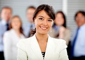 image of leadership  - Business woman leading her team at the office - JPG 