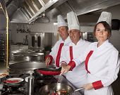 picture of industrial  - group of young beautiful professional chefs portrait in industrial kitchen - JPG 
