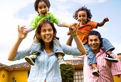 picture of laughter  - happy family portrait having fun outdoors at their home - JPG 