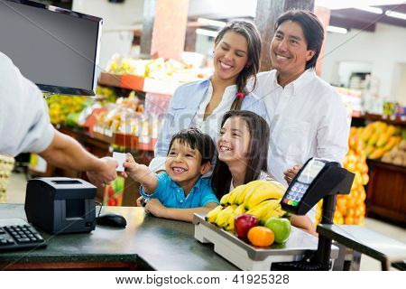 Picture or Photo of Family looking out for home finances at the supermarket