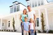 pic of standing  - Young Family Standing Outside Dream Home - JPG 