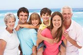 foto of beach  - Three Generation Family Relaxing On Beach Holiday - JPG 