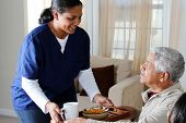 picture of health  - Home health care worker and an elderly couple - JPG 
