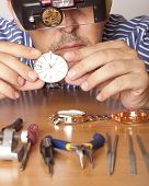 stock photo of watch  - Watch repair craftsman repairing watch - JPG 
