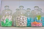 stock photo of health  - vintage drugstore glass jar with colored pills - JPG 