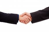 stock photo of handshake  - Two businessmen hands handshake isolated on white - JPG 