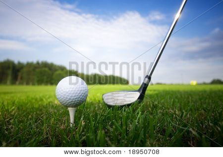 Picture or Photo of Playing golf. Golf club and ball. Preparing to shot
