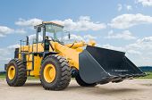 stock photo of construction  - One Loader excavator construction machinery equipment over blue sky - JPG 