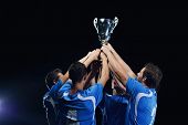 foto of group  - soccer players team group celebrating the victory and become champion of game while holding win coup - JPG 