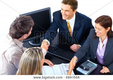 Picture or Photo of Smiling business people team working in the office