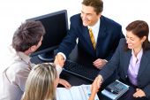 stock photo of business people  - Smiling business people team working in the office - JPG 